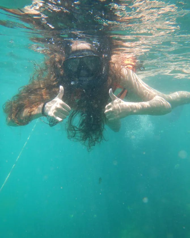 Girl swimming underwater.