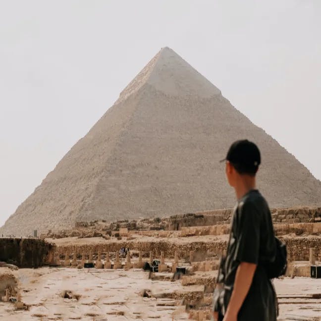Man looking at an Egyptian Pyramid.