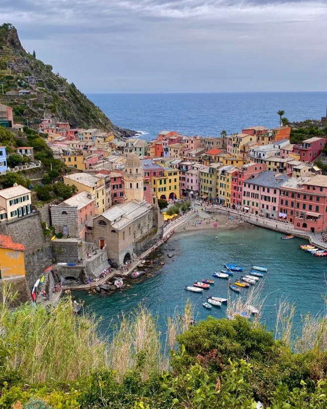 Beautiful view of Vernazza, Italy with colorful buildings around water