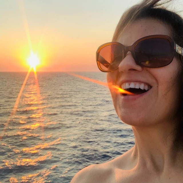 Picture of Sandra with a beautiful sunset