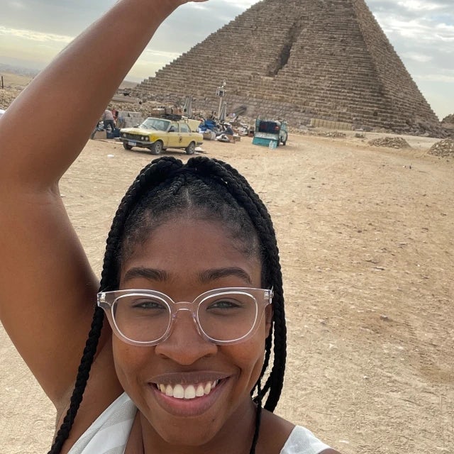 Travel advisor Charine standing in front of a pyramid in Egypt